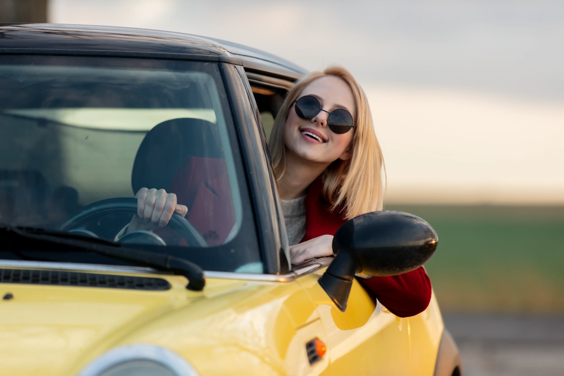 style-blonde-woman-in-sunglasses-and-red-coat-in-c-2023-11-27-04-53-33-utc